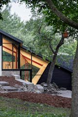 A Massive New Roof Turns a ’70s Chalet in Canada Into a Forest Palace