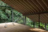 A Massive New Roof Turns a ’70s Chalet in Canada Into a Forest Palace
