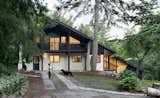 A Massive New Roof Turns a ’70s Chalet in Canada Into a Forest Palace