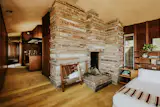 In the primary suite, a quarried stone stands near the bed.&nbsp;