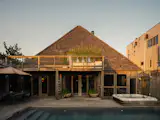 Located on the quiet eastern edge of the Pines, neighboring protected landscape, the home provides plenty of privacy. 