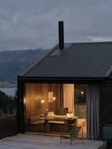 This New Zealand Tiny Cabin’s Glass Sliders Are So Big They Hang Off the Side