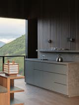 This New Zealand Tiny Cabin’s Glass Sliders Are So Big They Hang Off the Side