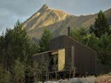This New Zealand Tiny Cabin’s Glass Sliders Are So Big They Hang Off the Side