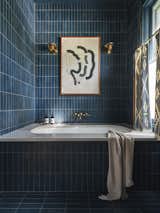Bath Room, Cement Tile Floor, Quartzite Counter, Wall Lighting, Stone Tile Wall, and Undermount Tub Primary Bath  Photo 14 of 20 in Graham Bybee House by Kartwheel Studio