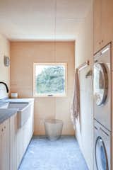 Laundry Room, Stacked, Stone Counter, and Wood Cabinet  Photo 6 of 17 in House on a Ridge in Maine by Barrett Made | Maine Architecture + Construction