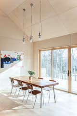 Dining Room, Chair, Table Lighting, Ceiling Lighting, Table, Pendant Lighting, and Light Hardwood Floor  Photo 7 of 17 in House on a Ridge in Maine by Barrett Made | Maine Architecture + Construction