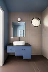 Bath Room, Vessel Sink, Ceramic Tile Wall, Ceramic Tile Floor, and Wall Lighting  Photo 10 of 29 in Stepped Volumes Apartment by Ale Preda Architecture