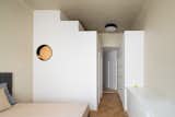 Bedroom, Wardrobe, Medium Hardwood Floor, Ceiling Lighting, and Bed  Photo 9 of 29 in Stepped Volumes Apartment by Ale Preda Architecture