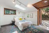 The downstairs side bedroom has its own separate entrance making a perfect place for guests. The skylights let in a natural abundance of light. 