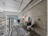 Sky Bridge offers cinder block walls, exposed pipes, and a view outside