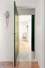 The two bedrooms and the opened green painted  mapple wood doors