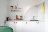 Kitchen, White Cabinet, Undermount Sink, and Marble Backsplashe The kitchen, semicircular and foldable coffee table and the Carrara marble rounded backsplash  RHAD Architects’s Saves from The circle and the triangle