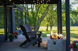 Outdoor, Concrete Patio, Porch, Deck, Trees, Hanging Lighting, Grass, and Concrete Pools, Tubs, Shower Fire pit in the Summer  Photo 4 of 16 in The Scenic Orchard by Emily Broomfield