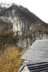 The slate roof mirrors the surrounding landscape