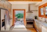 Kitchen opening to an inviting porch