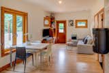 Living room with efficient wood burning fireplace mounted on the wall