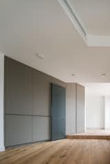 Floor materials are carefully chosen to bring back this traditional look to the space: the clay ceramic tiles and the oil-stained wooden floor call for a vernacular architecture, where these kinds of domestic and sunny interiors are typical.