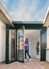Folding doors system allows indoor and outdoor spaces blending together.