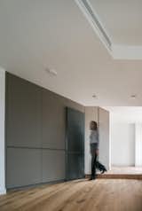 Storage closets hidden in the west wall and detail of ceiling treatment.