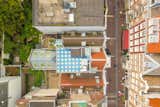 The basketweave tiles were selected for roof as a wink to Delft Blue, the famous Dutch pottery, and so that the building could be easily found on Google Earth.