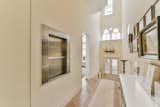 The grand hallway pulls light through the building, a precious commodity in a very narrow city.