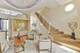 The sweeping cantilever staircase is a true masterpiece, with an accordion like dance to the reception.