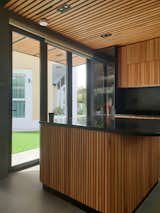 Kitchen, Wood Cabinet, Porcelain Tile Floor, and Granite Counter Copyright 2021    www.ngsarchitects.com  Photo 2 of 15 in 0/2 Mudon by ngs architects