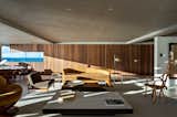 Only one of the four façades of the unit has a view of the sea, therefore,  to bring to that façade the most intense usage of the residents, all the common living spaces are located there.
