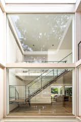 Staircase, Metal Tread, Glass Railing, Concrete Tread, and Metal Railing  Photo 19 of 20 in R House by Studio Arthur Casas
