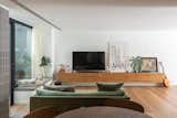 Living Room, Sofa, Console Tables, Ceiling Lighting, Media Cabinet, Medium Hardwood Floor, and Accent Lighting  Photo 3 of 22 in Globa Apartment by Ariel Glot