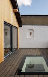 As part of the renovation, an informal roof terrace was replaced with a  structurally safe roof terrace accessed via new aluminium sliding doors from the master bedroom.