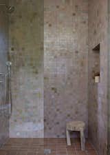 Secondary bathroom with zellige tile walls. 