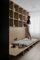 Shelving unit converted into the relaxation platform with the library over.