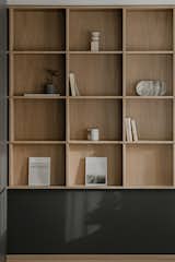 Ascetic geometry of a shelving unit within the main living space.