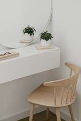 Floating dressing table in the master bedroom, accompanied by classic J77 chair by HAY.