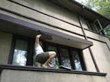 Jason painting the underside of the window hood a subtle gray.