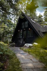 Exterior, A-Frame RoofLine, Cabin Building Type, Glass Siding Material, Wood Siding Material, Shingles Roof Material, and Concrete Siding Material The front door of the A-frame  Photo 2 of 13 in Exterior by somaye radfar from Lakeview A-frame