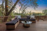 Outdoor, Front Yard, Trees, Hanging Lighting, and Large Patio, Porch, Deck Epic view from many of the outdoor spaces  Photo 16 of 18 in Artful treehouse by Kim Baskind