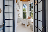 Octagonal bedroom with super tall ceilings and loft above 