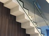 Staircase, Metal Railing, Wood Tread, Concrete Tread, and Glass Railing Concrete, steel, glass and wood steps…  Photo 4 of 16 in Silver Bluff Townhouse - Miami by PRZ Design + Build