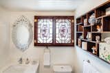Chinoiserie windows, shelf, porcelains in the bathroom
