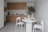 This minimal kitchen features a white terrazzo benchtop that compliments the light tone of the oak joinery.
