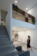 Concrete stairs leading to living spaces.