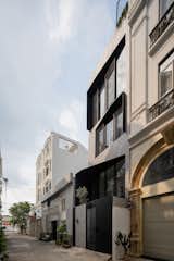The black protruded steel apertures help to control the solar heat gains on the south-facing windows.
