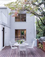Back yard kitchen and dining leads to a sunken terrace and cellar space.  Photo 4 of 40 in A Crisp Renovation is a SNAP for this Stale Gingerbread House by HxH Architects PLLC
