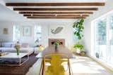 Dining Room, Table, Wood Burning Fireplace, Light Hardwood Floor, Accent Lighting, and Chair Dining and living room  Photo 15 of 40 in A Crisp Renovation is a SNAP for this Stale Gingerbread House by HxH Architects PLLC