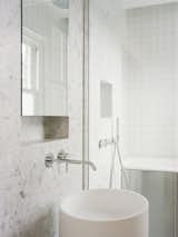 Bathroom fixtures complement surface finishes to inspire a feeling of cleanliness.