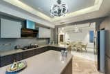 The living room, dining room and kitchen are articulated as one space, in order to eradicate the visual boundaries between them.