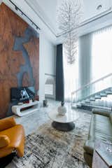 Our client enjoyed art collection, for which the double height area was the perfect space to display these art pieces. A majestic chandelier falls down in the living area in which its design reminds of nature